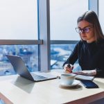 freelancer in Europe working on laptop managing international payments and finances