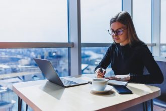 freelancer in Europe working on laptop managing international payments and finances