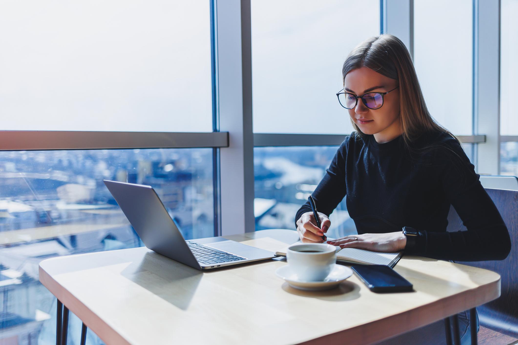 freelancer in Europe working on laptop managing international payments and finances